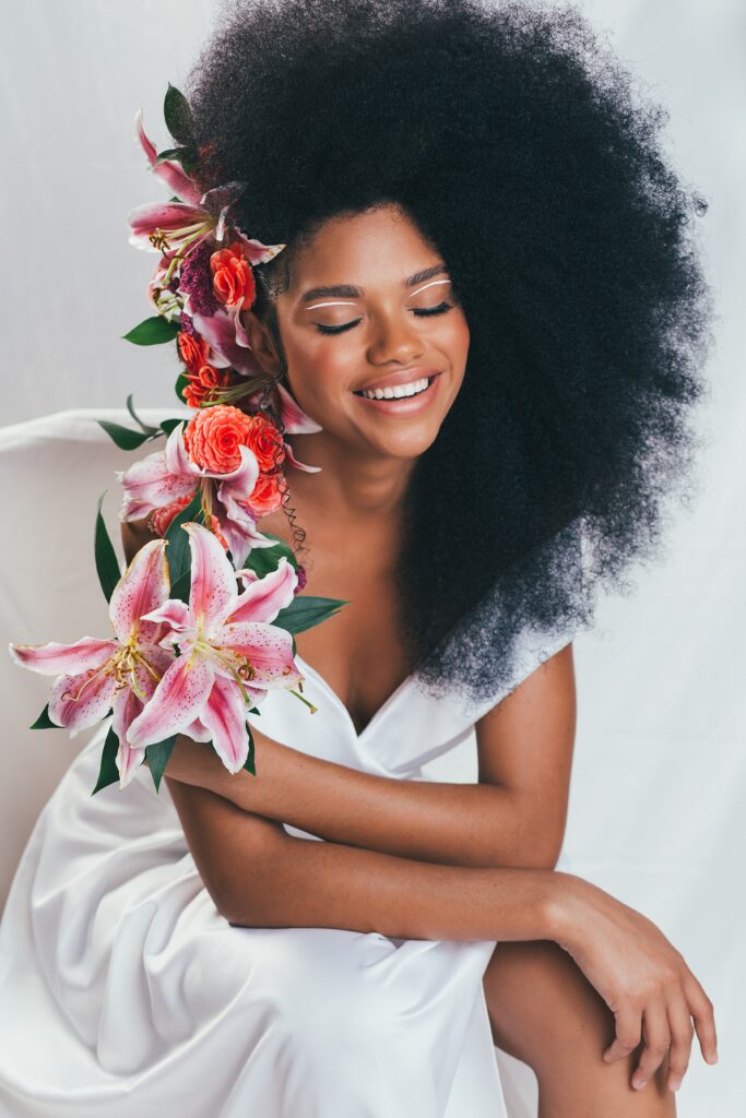 A Black bride with flowers in her hair